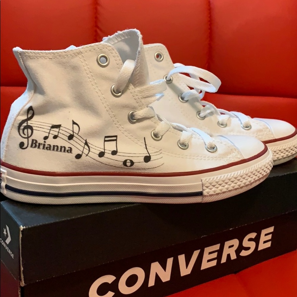 Girl’s white Converse, Chuck Taylor High Tops